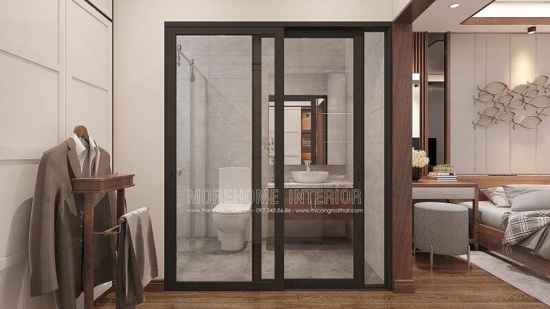 Bạn đang băn khoăn với ý tưởng bố trí phòng ngủ nam khép kín khi sử dụng gỗ óc chó làm vật liệu chủ đạo phòng ngủ thì phòng tắm nên bố trí như nào cho hợp lý mà vẫn giữ nguyên vẻ đẹp sang trọng đó. Ý tưởng trang trí phòng tắm cửa kính trượt viền đen kết hợp không gian màu xám từ gạch ốp giả bê tông cùng tủ đựng đồ phòng tắm bề mặt đá vân mây với lớp cánh gỗ óc chó sẽ là gợi ý khá độc đáo trong căn hộ chung cư, nhà phố, nhà liền kề, biệt thự.